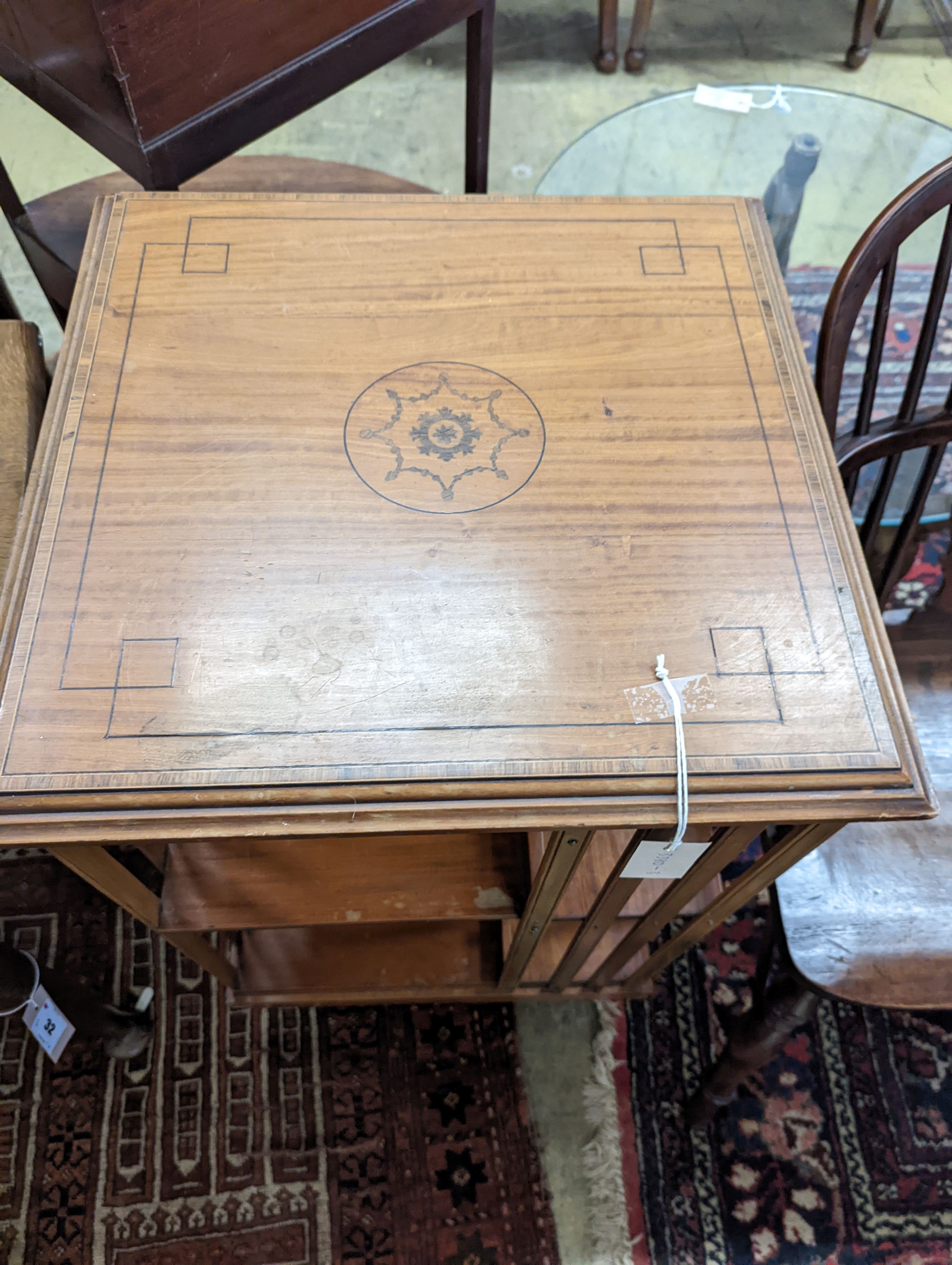 An Edwardian inlaid satinwood revolving bookcase, width 48cm, depth 47cm, height 85cm